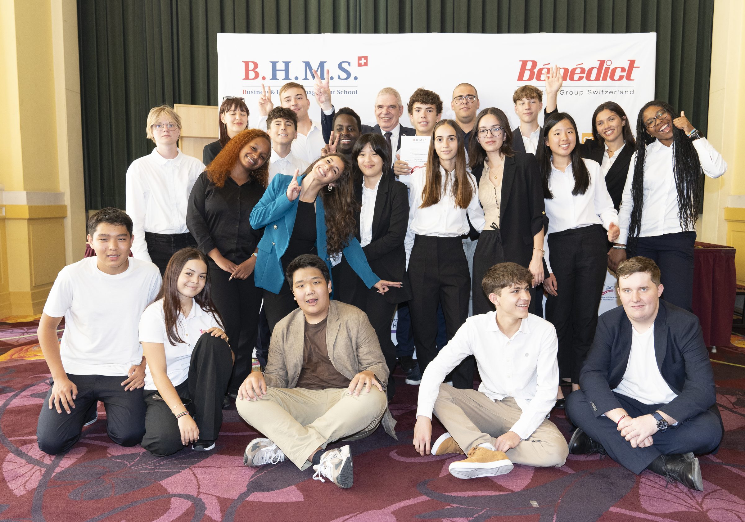International summer camp cohort with BHMS banner