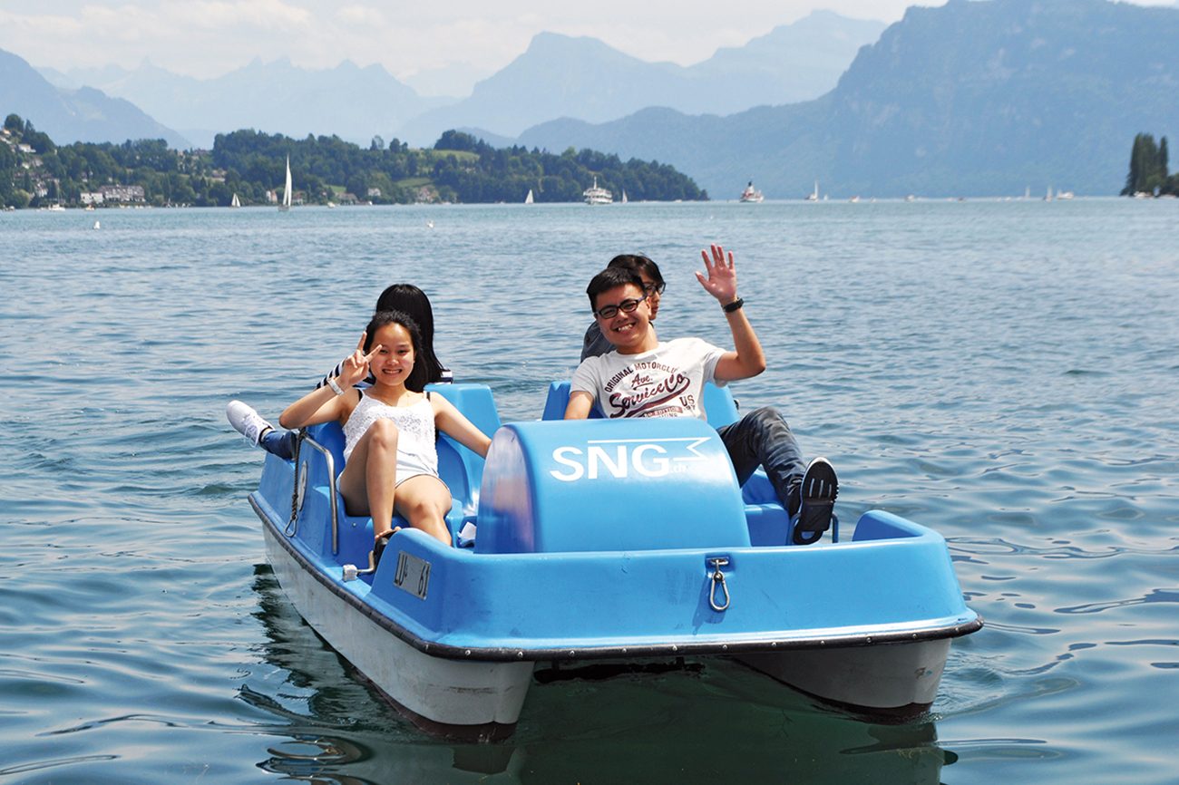 Campers pedal-boating on Lake Lucerne